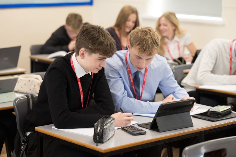 Students in lesson in correct dress code 