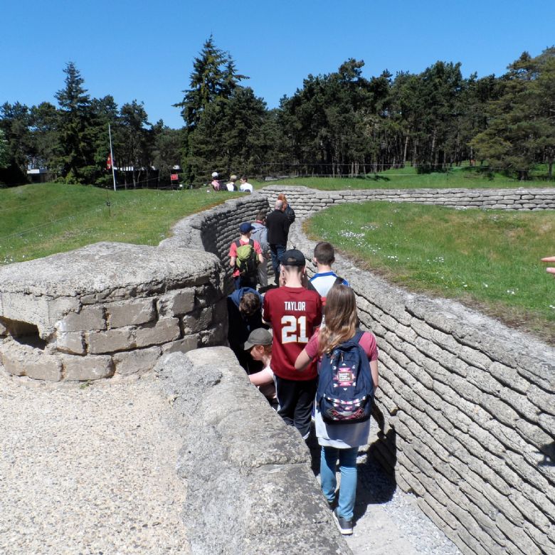 Students in war trench in sunshine