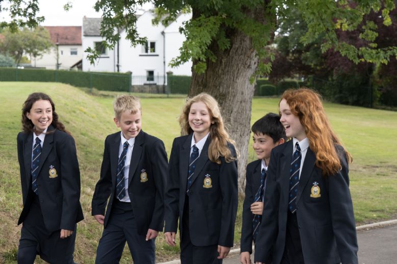 Students laughing together walking