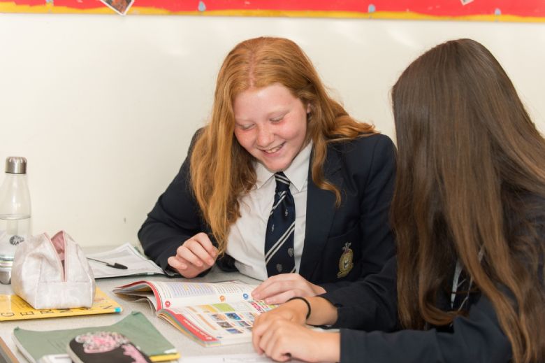  Students working with textbook