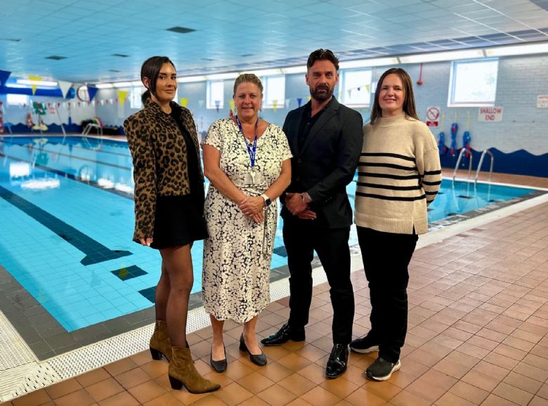 Headteacher with Staff from InGear Swim by swimming pool.
