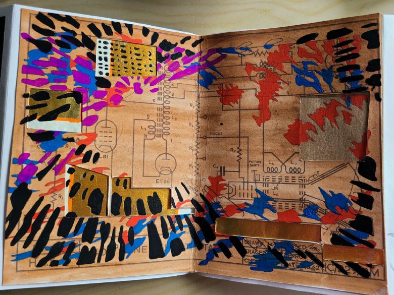 Multi coloured journal page with gold highlights