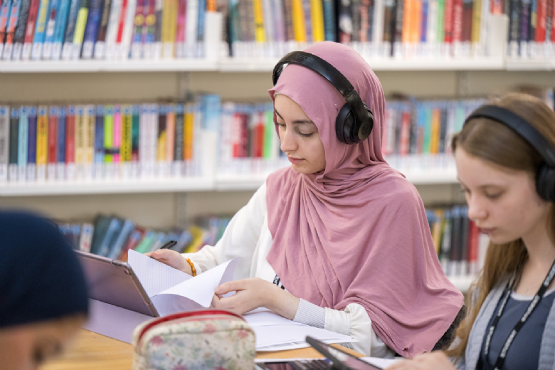 Girl working in the library