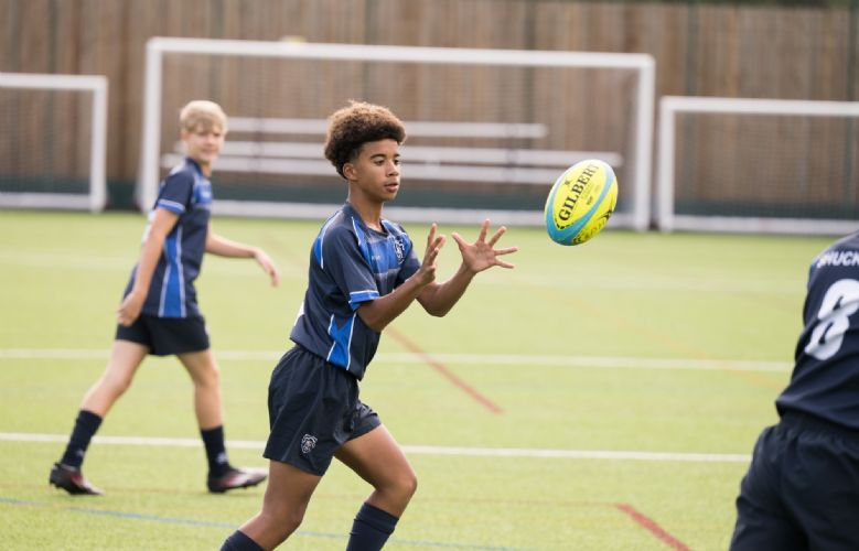Female rugby player throwing a ball