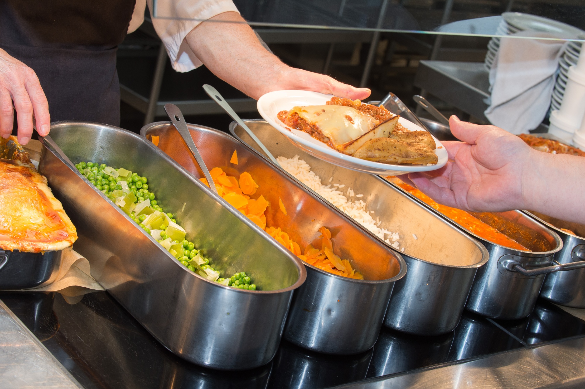 Henry's Diner servery, showing food being handed over to student